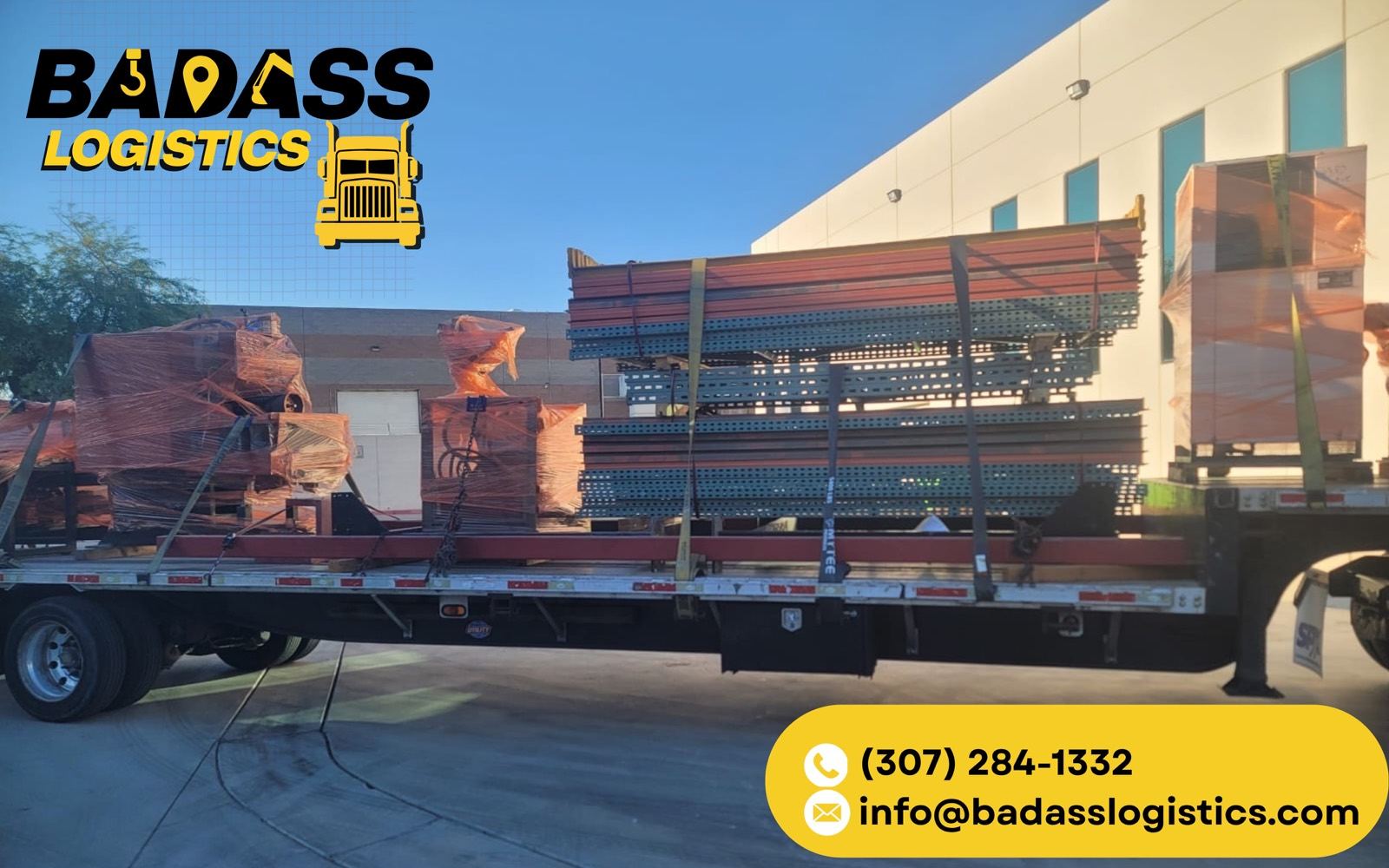 Flatbed loaded with industrial pallet racking and steel uprights